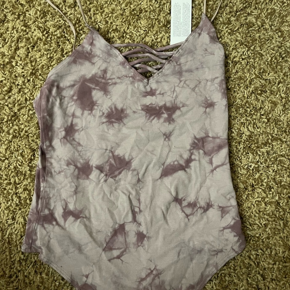 Purple tie dyed tax top body suit, with cross design
